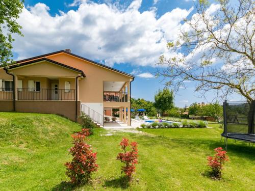 a house in a yard with a bench at Holiday Home Marina by Interhome in Labin