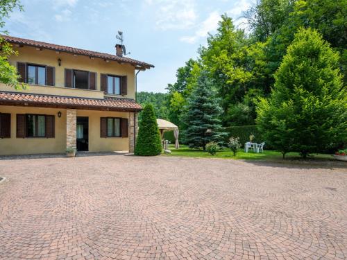 a brick driveway in front of a house at Holiday Home Casa Nocciola by Interhome in Ferrere