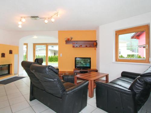 A television and/or entertainment centre at Holiday Home Heidi by Interhome
