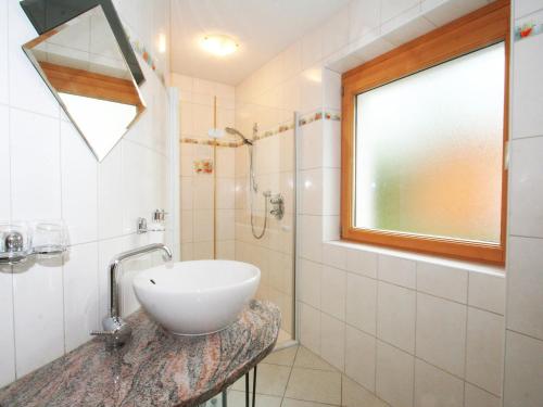 a bathroom with a sink and a shower at Holiday Home Heidi by Interhome in Rieden