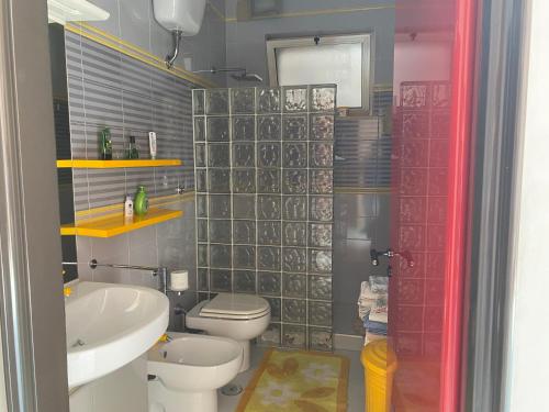 a bathroom with a toilet and a sink at Dimora Nina in Sannicandro di Bari