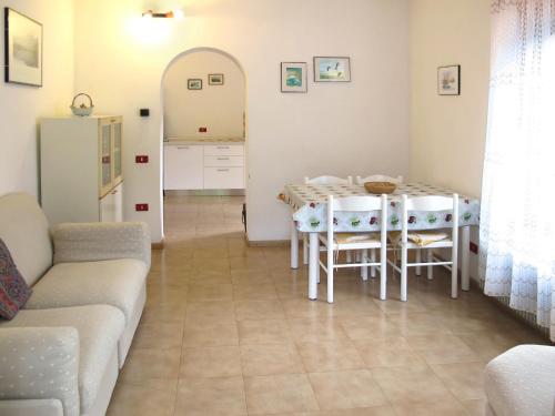 a living room with a table and a couch at Apartment Angeli by Interhome in Vignola