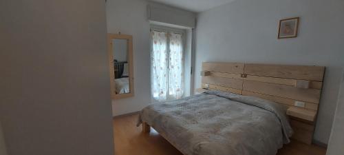 מיטה או מיטות בחדר ב-Albergo Vittoria