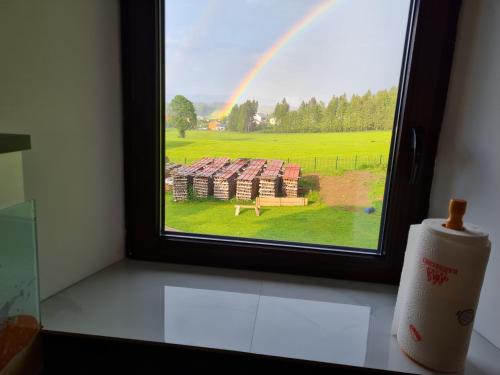 a view of a rainbow from a window with a room at Ferien- und Businesswohnung Relax im ersten Stock in Sonnen