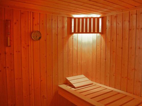 a sauna with a bench in a wooden wall at Holiday Home Krechen Alm by Interhome in Pernegg an der Mur