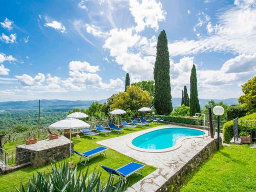 a villa with a swimming pool and lawn at Holiday Home Il Casellino-1 by Interhome in Case Malva