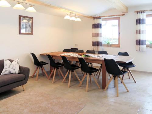 a dining room with a table and chairs at Apartment Luxner - KAB137 by Interhome in Kaltenbach