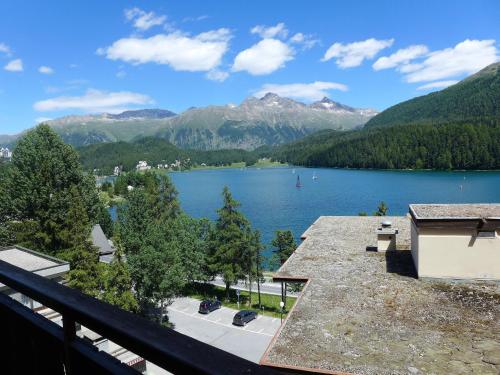 a view of a lake from a balcony at Apartment Chesa Sonnalpine B 46 by Interhome in St. Moritz