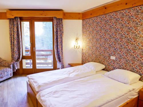 Postel nebo postele na pokoji v ubytování Apartment Le Bristol A38 by Interhome