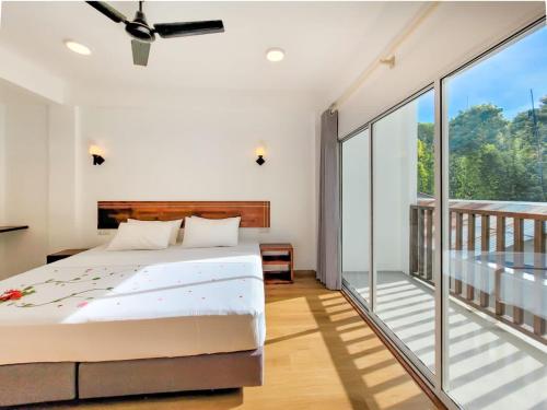 מיטה או מיטות בחדר ב-Dhonkamana Stay