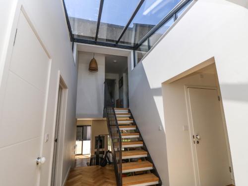 a staircase in a house with a glass roof at Aquanaut in Cowes