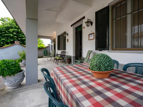 a table with a potted plant on a patio at Holiday Home Casa della Peschiera by Interhome in Isola d'Asti