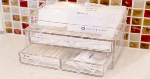 a stack of plastic containers filled with toilet paper at Kyoto Hot Spring Hatoya Zuihokaku Hotel in Kyoto