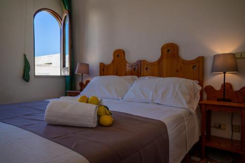 Postel nebo postele na pokoji v ubytování Hotel Rojas