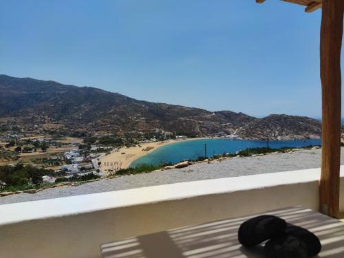 a view of a body of water from a balcony at Almyriki in Mylopotas
