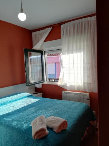 Ένα ή περισσότερα κρεβάτια σε δωμάτιο στο O Encontro