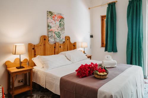 Postel nebo postele na pokoji v ubytování Hotel Rojas
