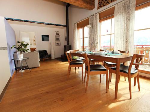 a dining room with a table and chairs at Apartment Ardève 13 by Interhome in Ovronnaz