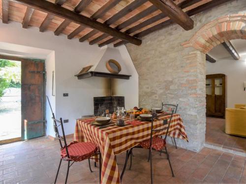 a dining room with a table and chairs at Holiday Home Casale Antica Pietra by Interhome in Gemmano