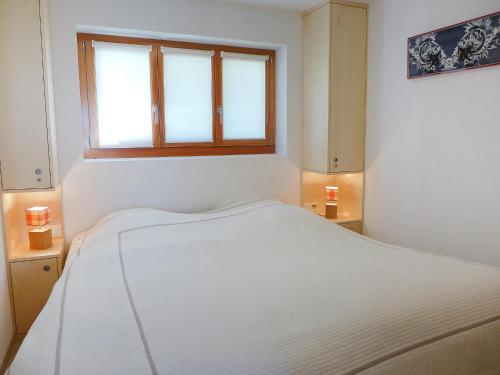 Apartment Les Aiguilles Vertes by Interhomeにあるベッド