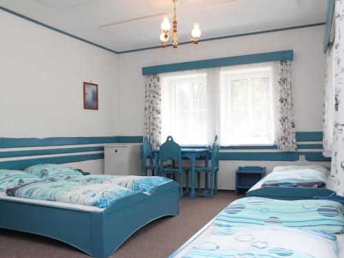 En eller flere senge i et værelse på Chalet Karlovka by Interhome