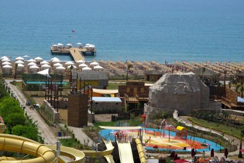 a water park with a water slide and a playground at Aska Lara Resort & Spa Hotel in Lara