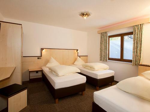 Ένα ή περισσότερα κρεβάτια σε δωμάτιο στο Apartment Alpin-7 by Interhome