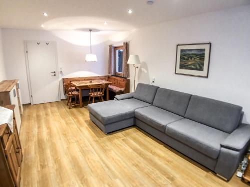 a living room with a couch and a table at Apartment Holger by Interhome in Zell am See