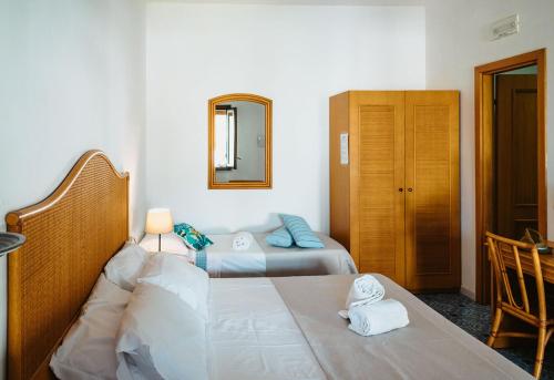 Postel nebo postele na pokoji v ubytování Hotel Rojas