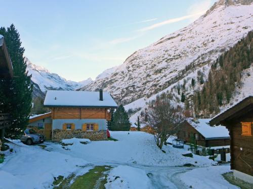 a house in the snow with a mountain at Chalet Coquelicot by Interhome in Zinal