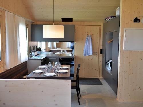 Dapur atau dapur kecil di Holiday Home Superior Aclas Maiensäss Resort-1 by Interhome