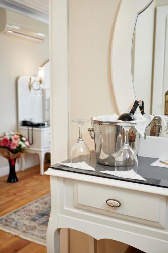 a white dresser with a mirror on top of it at Mataraci Konak in Istanbul