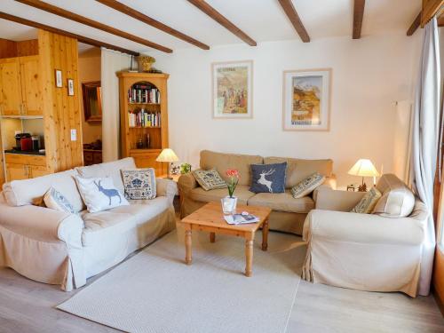 a living room with two couches and a coffee table at Apartment Diamant 1 by Interhome in Villars-sur-Ollon