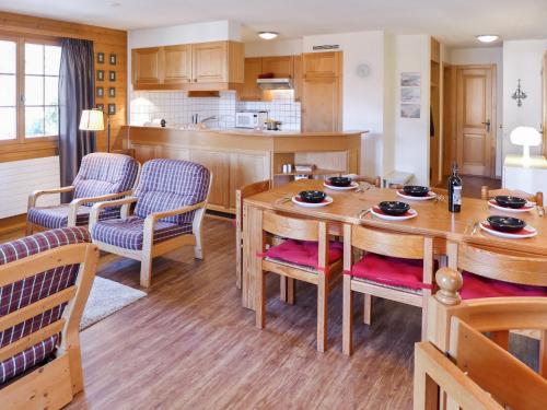 a kitchen and dining room with a table and chairs at Apartment Le Miclivier B1 by Interhome in Villars-sur-Ollon