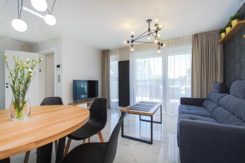 TV a/nebo společenská místnost v ubytování APARTAMENT VIVALDI