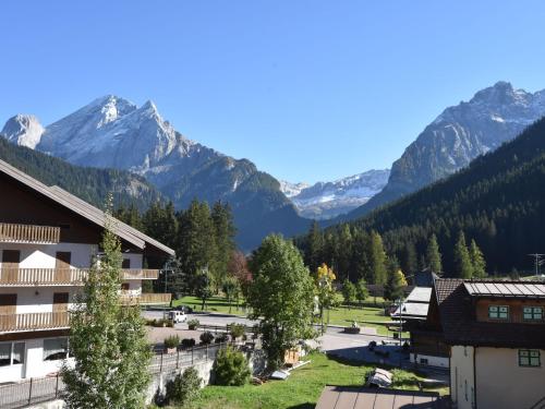 a view of a village with mountains in the background at Apartment Cesa Lucilla by Interhome in Canazei
