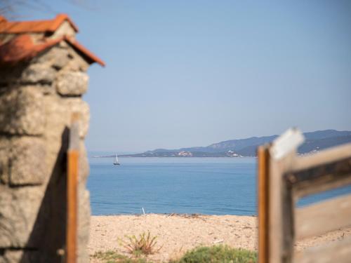 a view of the ocean from a beach at Boutique hôtel Château Rouher in Propriano