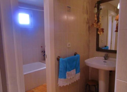 a bathroom with a sink and a bath tub at Casa Rural Jose Trullenque in Morella