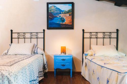 A bed or beds in a room at Alojamiento rural Las Alberquillas