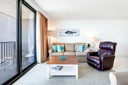 a living room with a couch and a table at Sea Colony --- 508 Brandywine house in Bethany Beach