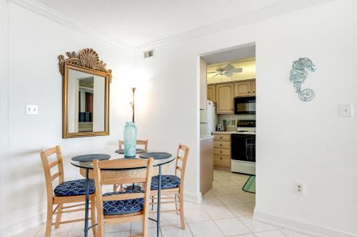 a dining room with a table and chairs and a mirror at Sea Colony --- 508 Brandywine house in Bethany Beach