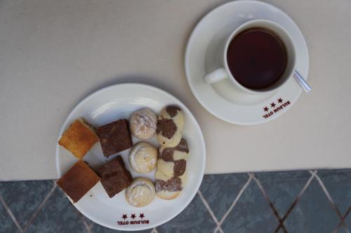 a plate of pastries and a cup of coffee at Buldum Otel in Ankara