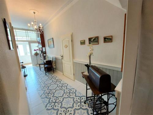 a hallway with a room with a table and chairs at Villa Meeresglück in Sassnitz