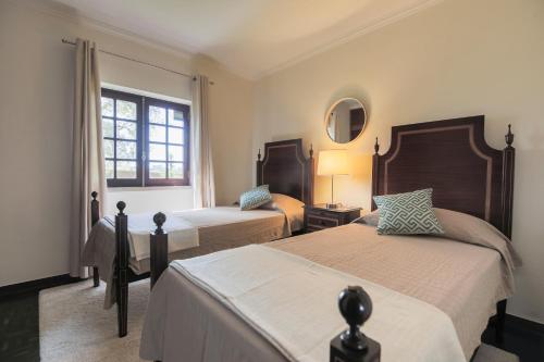 Postel nebo postele na pokoji v ubytování Villa 160