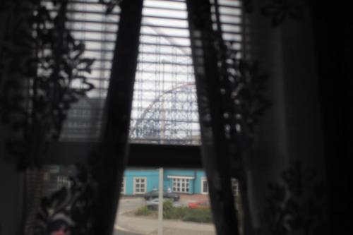a view of a ferris wheel from a window at Kings Boutique Hotel in Blackpool
