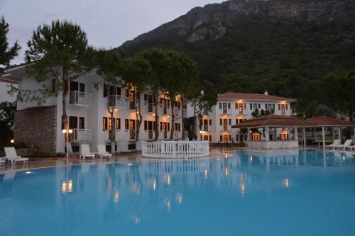 a large swimming pool in front of a hotel at White Hotel in Oludeniz