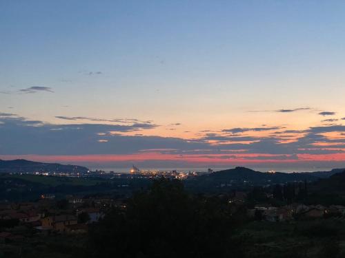 a view of a city at sunset at Apartma Mija-Dekani in Dekani