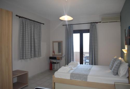 Ένα ή περισσότερα κρεβάτια σε δωμάτιο στο Asteras Apartments