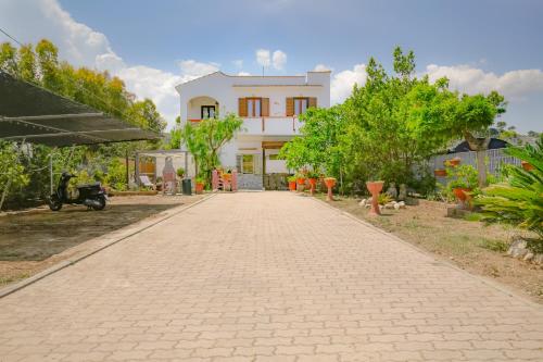 a brick road in front of a house at Villa Latino in Vieste