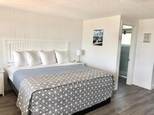 Ένα ή περισσότερα κρεβάτια σε δωμάτιο στο Kingfisher Oceanside